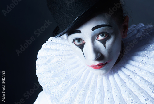 Sad mime Pierrot, closeup portrait photo