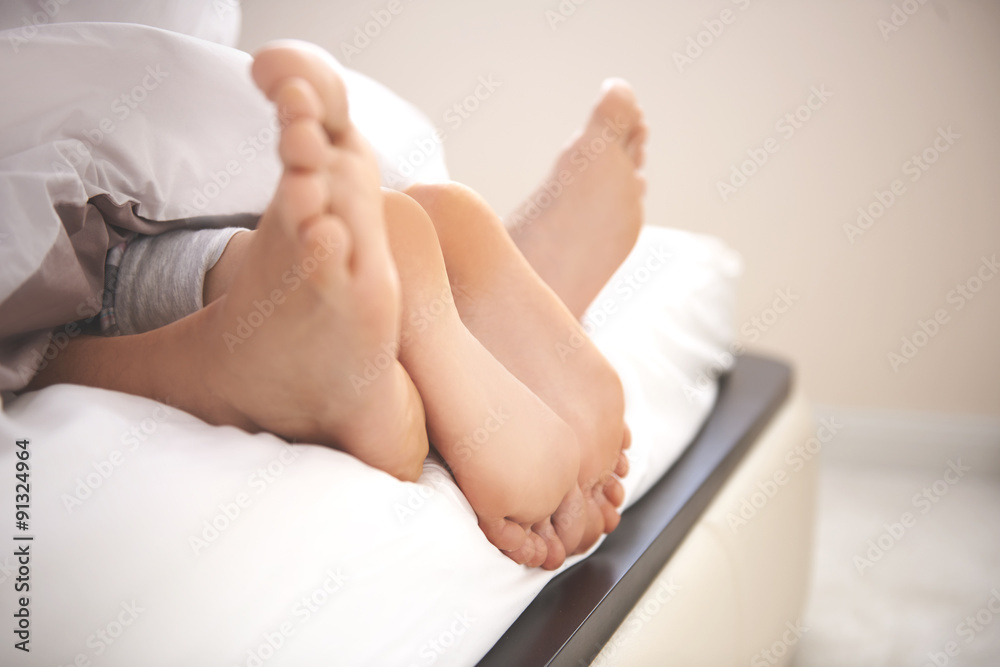 Human feet as a symbol of very close relationship Human feet as a symbol of very close relationship