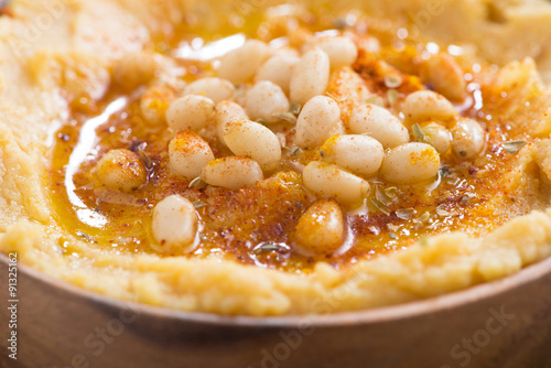 Traditional hummus in bowl, close-up, selective focus