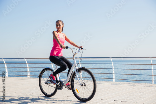 Woman riding on bicycle outdoors