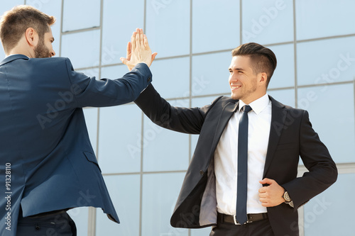 Two  business colleagues high-fiving