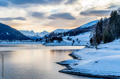 Evening winter scenery of Davos Lake, Switzerland. © borisbelenky