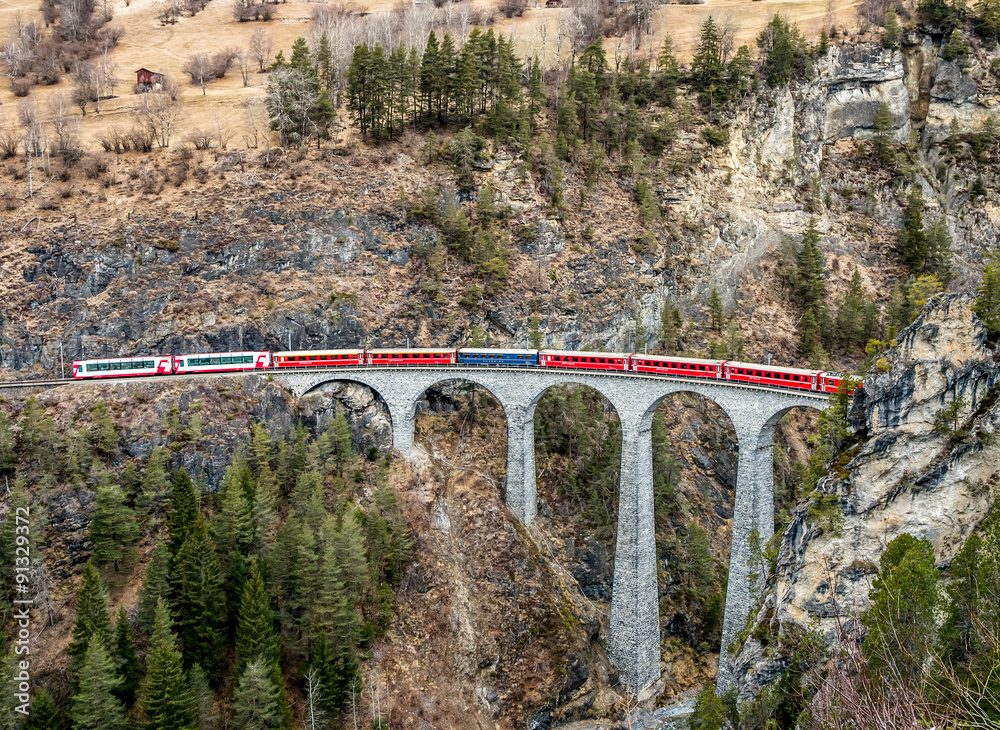 Naklejka premium Bernina express above Landwasser Viaduct at Filisur, Switzerland.