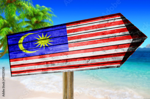 Malaysia Flag wooden sign on beach background photo