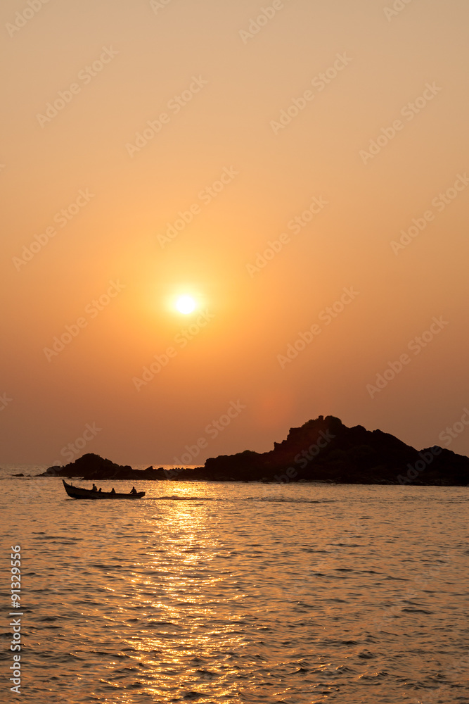 Rocky island silhouette and sunset Rocky island silhouette and sunset