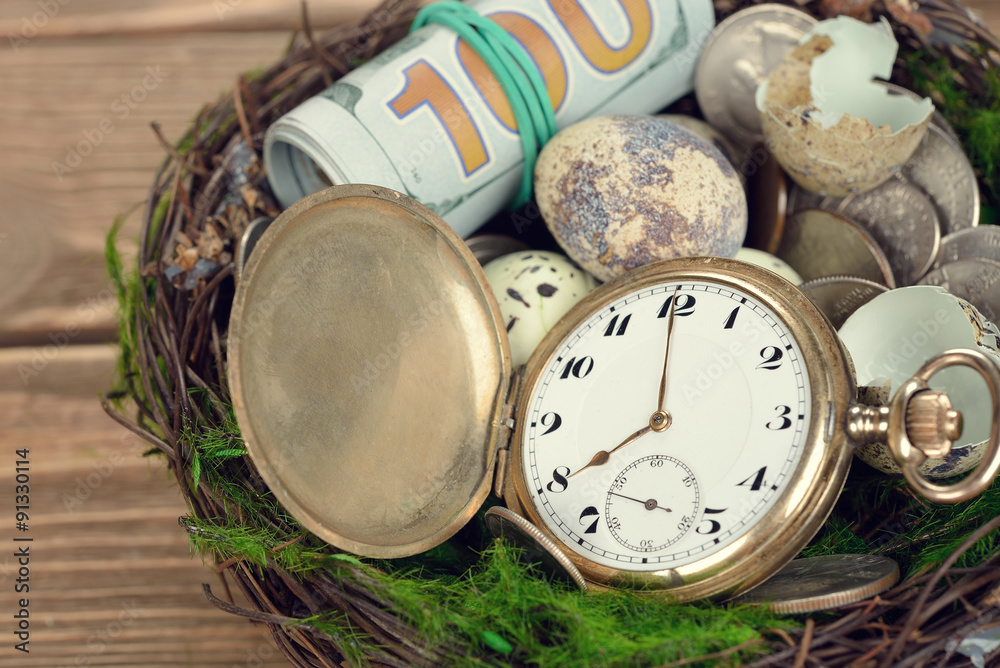 Watches, money, and eggs in a nest Watches, money, and eggs in a nest
