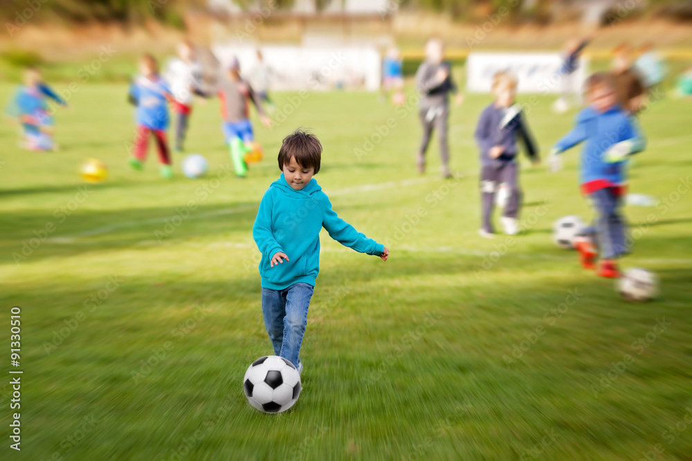 Group of children, playing football, exercising Group of children, playing football, exercising