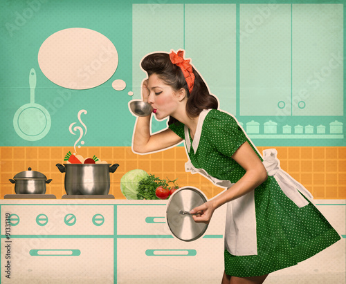 Young housewife testing her soup in the kitchen with speech bubb photo