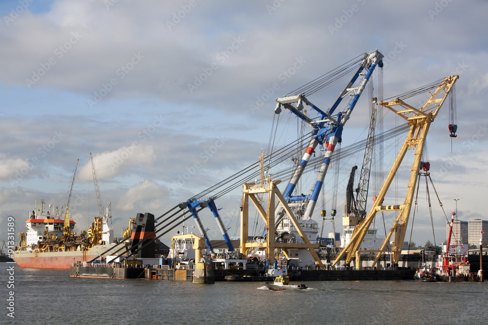 Two floating cranes and some ships in Rotterdam harbor