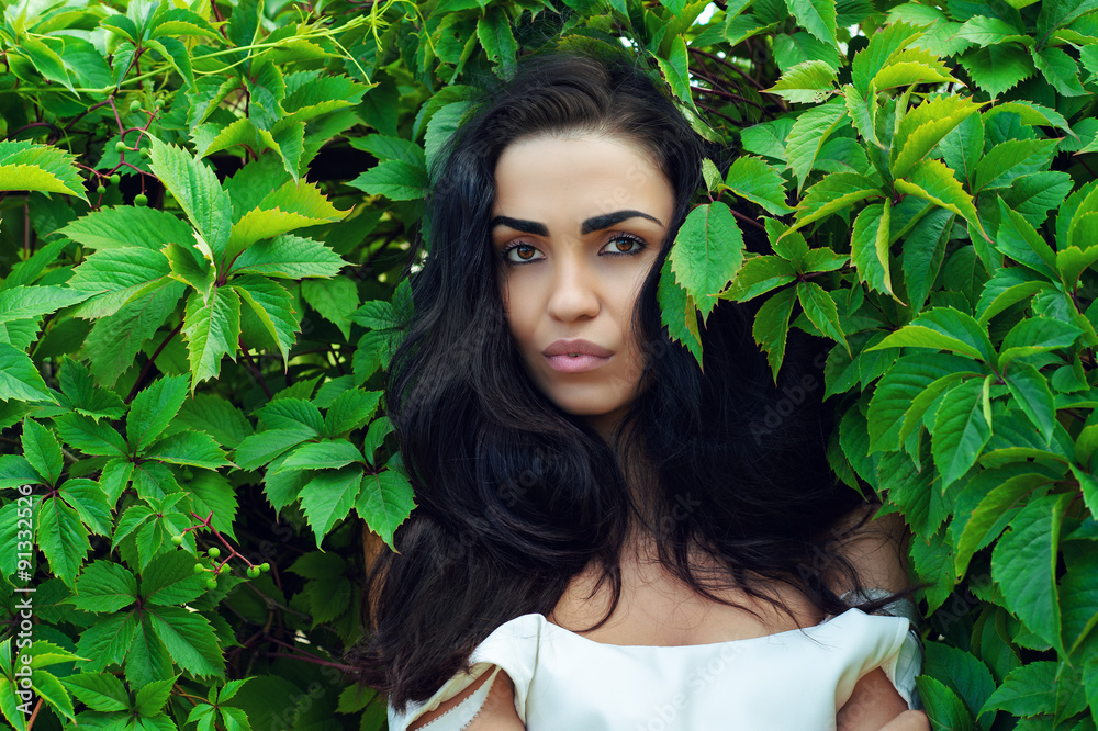 brunette in green leaves brunette in green leaves