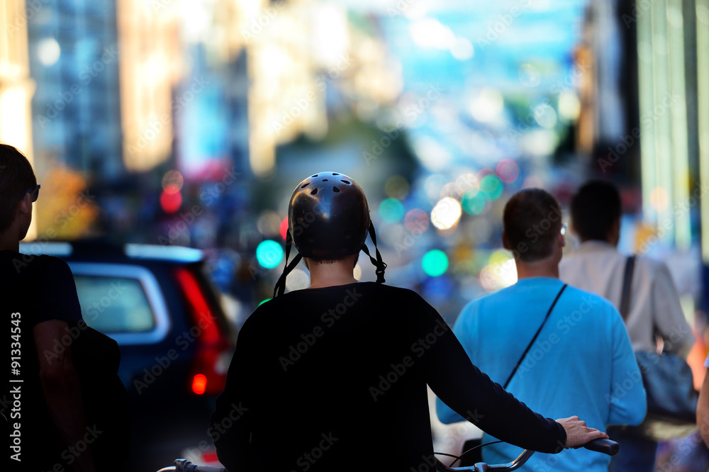 Man walking with bike. Wearing bicycle helmet. Man walking with bike. Wearing bicycle helmet.