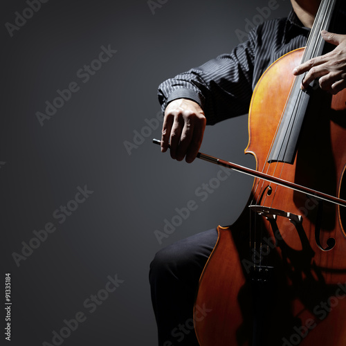 Cello player or cellist musician performing photo