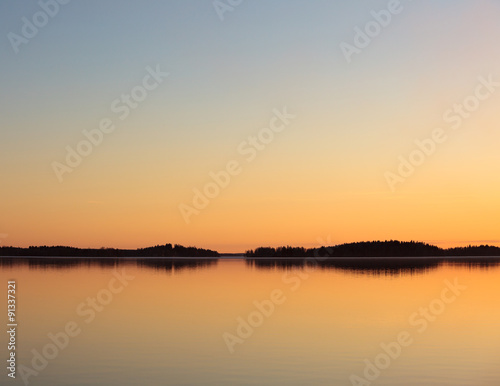 Serene lake view at dusk © Juhku