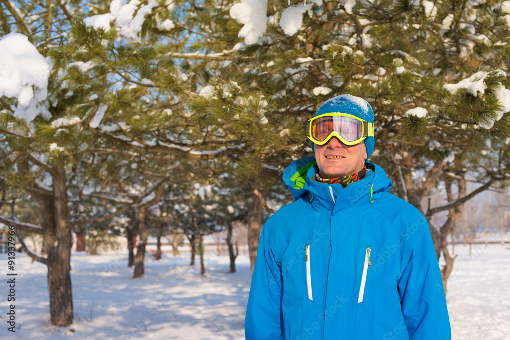 Portrait of sporty man who is wearing winter jacket and ski gogg Portrait of sporty man who is wearing winter jacket and ski gogg