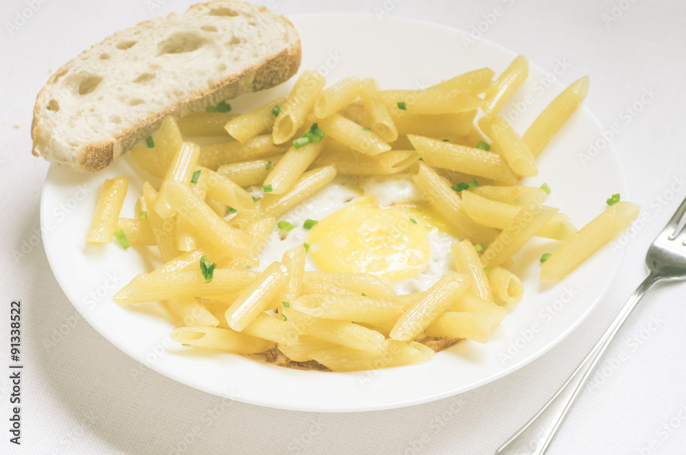 Penne pasta with fresh herbs and fried eggs Penne pasta with fresh herbs and fried eggs