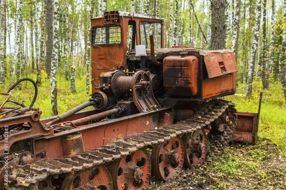 background old rusty abandoned orange tractor standing in the woods background old rusty abandoned orange tractor standing in the woods