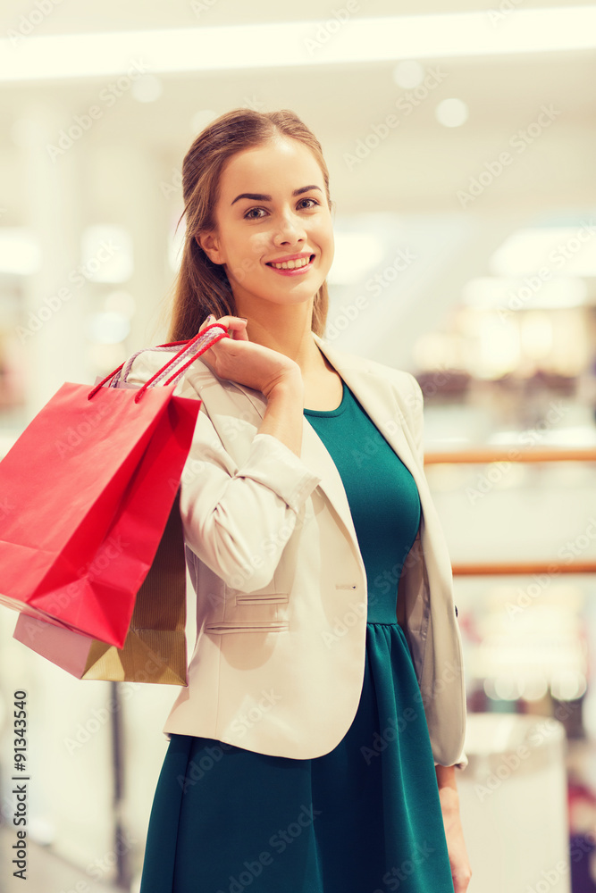 happy young woman with shopping bags in mall happy young woman with shopping bags in mall