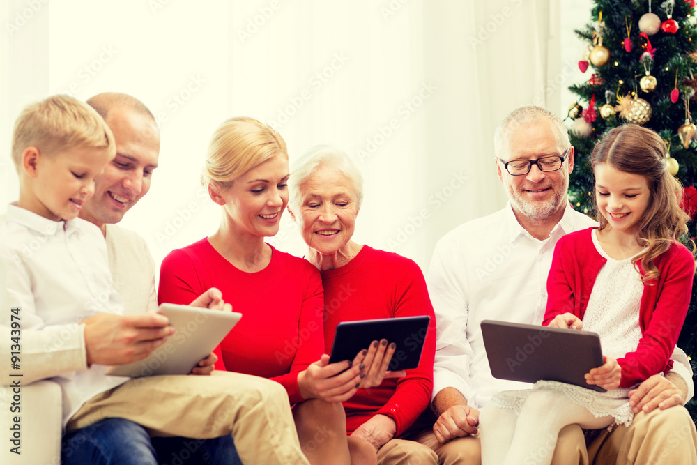 smiling family with tablet pc computers at home smiling family with tablet pc computers at home