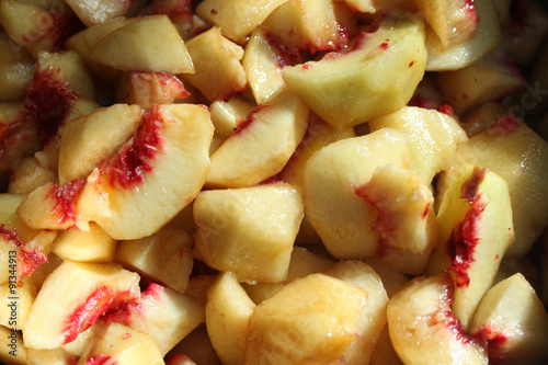 Sliced peaches. Cooking of peach jam or marmalad photo