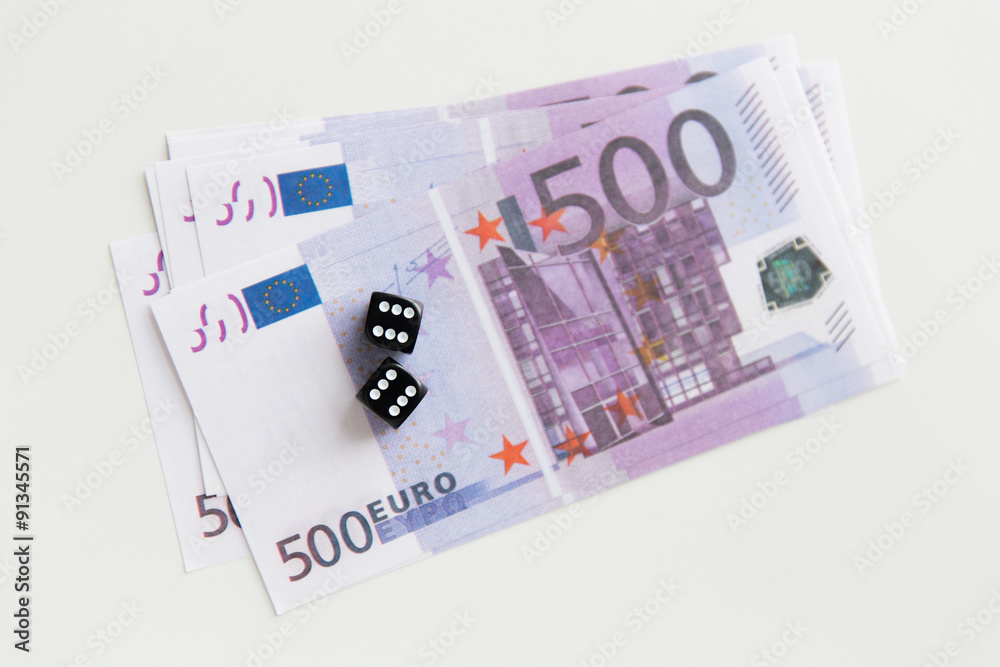 close up of black dice and euro cash money