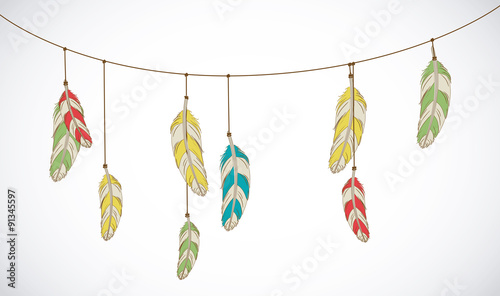 Vector colorful set of ethnic decorative feathers hanging on thread.