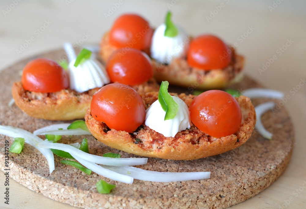 Italian Bruschetta With Mozzarella And Tomato On A Wooden Table Italian Bruschetta With Mozzarella And Tomato On A Wooden Table