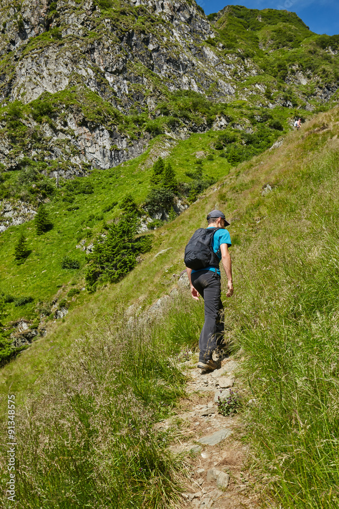 Teenage hiker on mountain trail