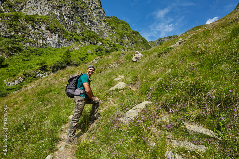 Hiker walking to the mountain peak