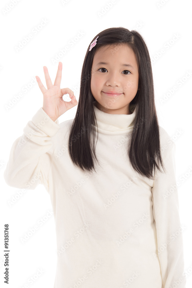 Cute asian girl in white turtleneck dress showing ok sign Cute asian girl in white turtleneck dress showing ok sign