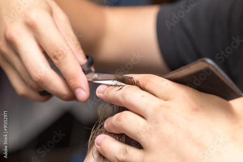 men s hair cutting scissors in a beauty salon