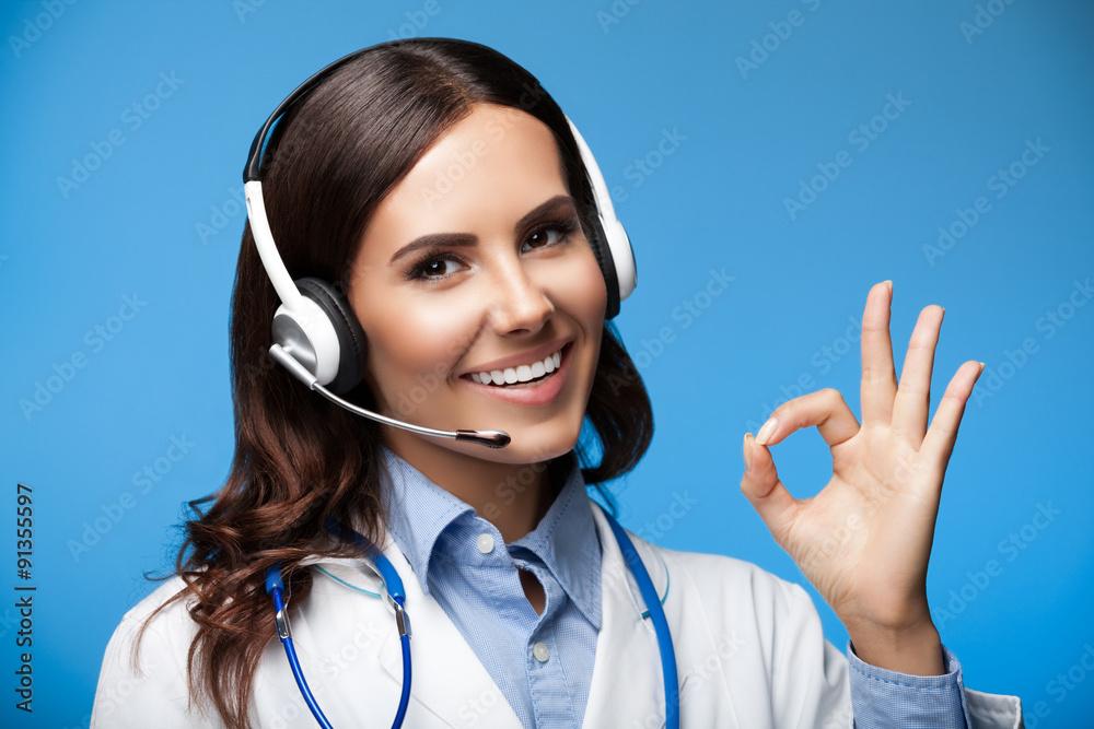 female doctor in headset, showing okay gesture female doctor in headset, showing okay gesture