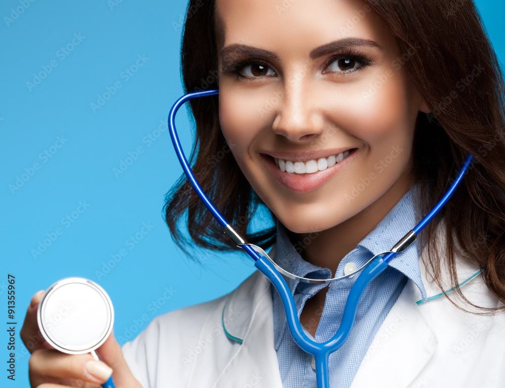 doctor with stethoscope in hand, on blue doctor with stethoscope in hand, on blue