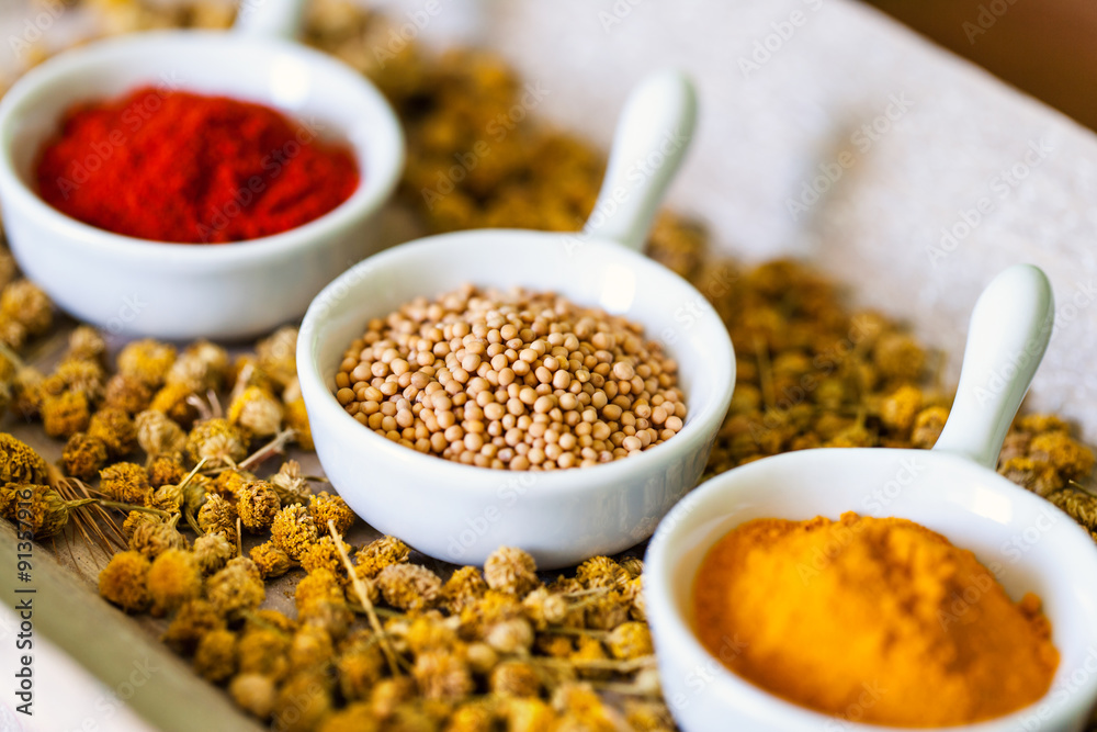 Aromatic herbs on bed of dried chamomile flowers. Aromatic herbs on bed of dried chamomile flowers.