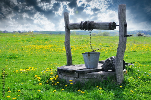 Cuadro en lienzo old water well at the countryside village