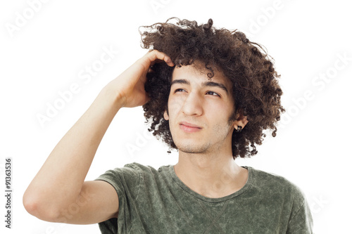 Young man scratching her head