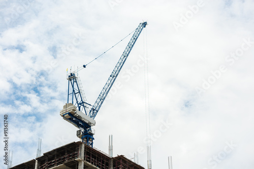 Construction crane on tower