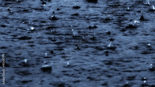 Heavy rain on water surface.