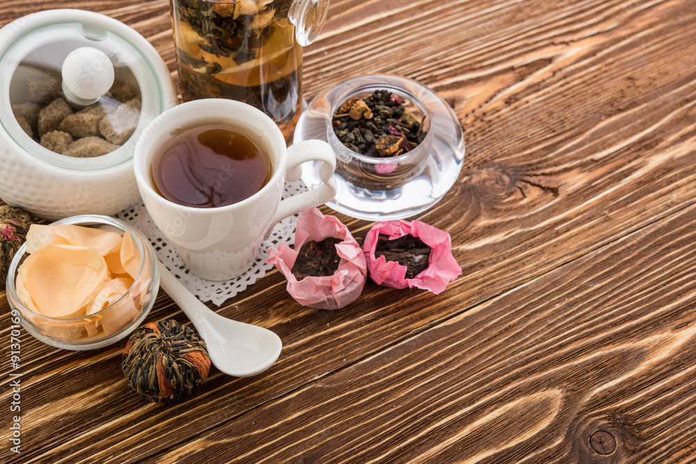 Tea cups with teapot on old wooden table Tea cups with teapot on old wooden table