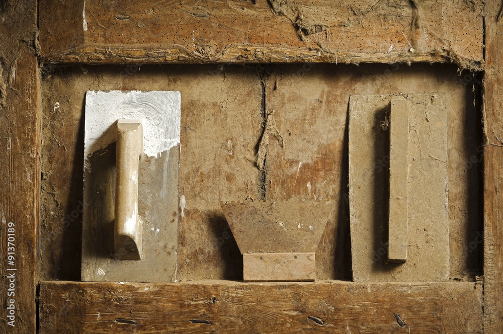 old  hand tools on antique wooden panel