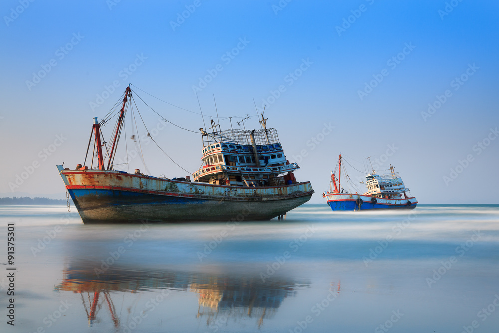 Sunset with wooden fishing boat in Thailand Sunset with wooden fishing boat in Thailand