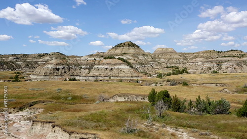 Camera pans across a view  overlooking the badlands in Theodore Roosevelt National Park in North Dakota, USA.