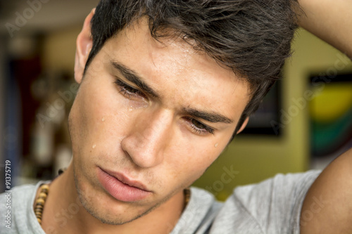 Close up Face of a Pensive Young Man Crying