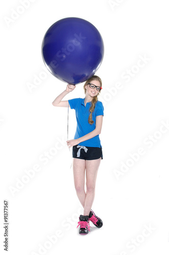 Full length young leisure woman with blue and red ball posing