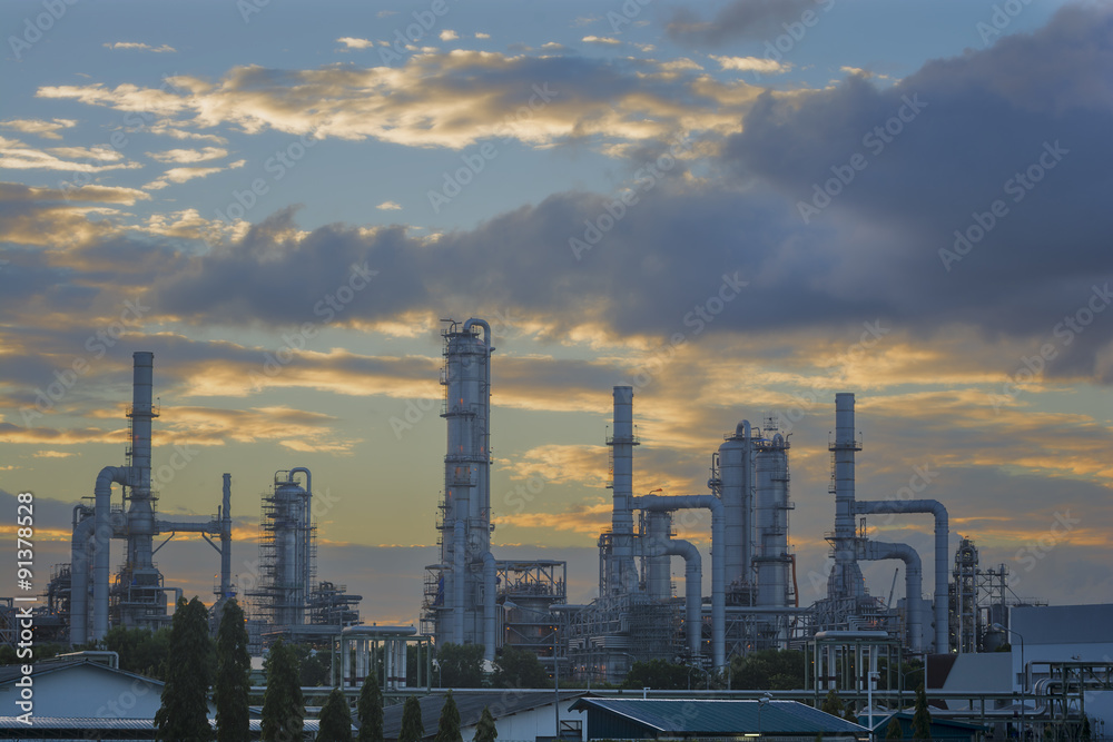 Silhouette of petrochemical plant or Oil and gas refinery in sunrise
