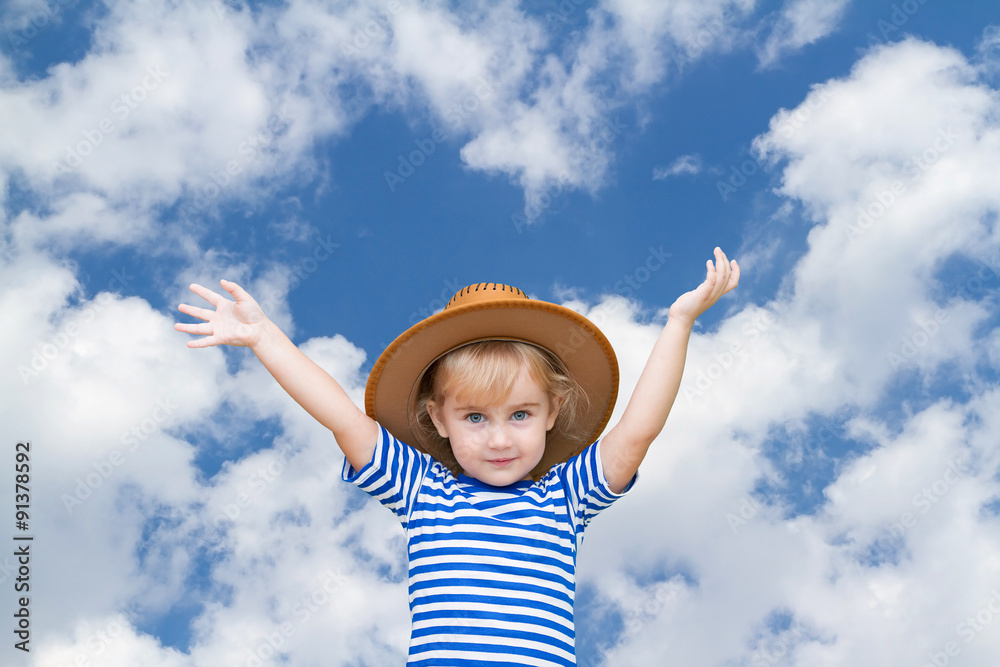 Little girl in a hat on a background of sky Little girl in a hat on a background of sky
