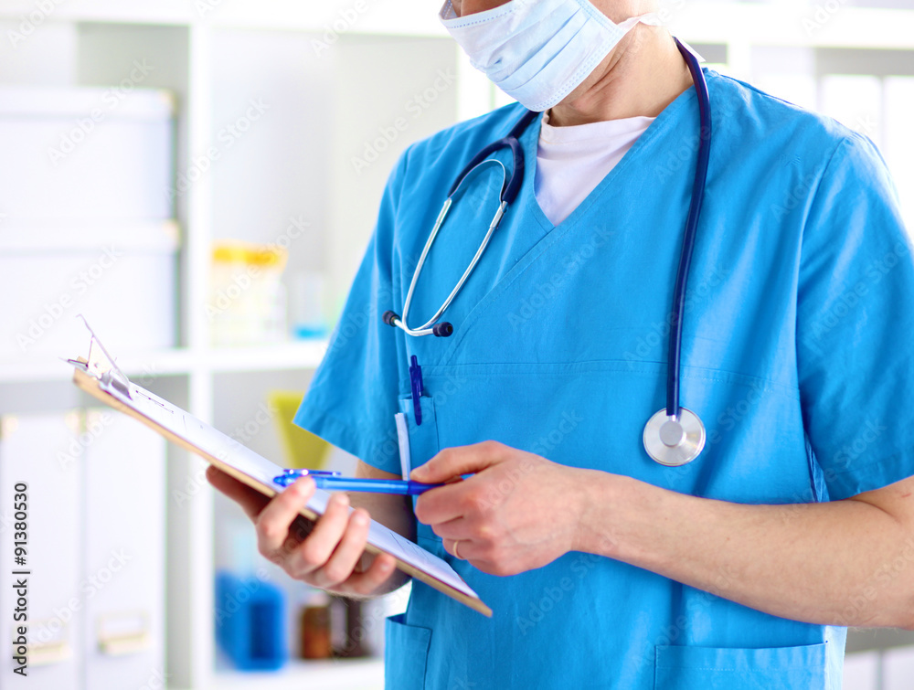 Closeup portrait of a doctor with stethoscope holding folder Closeup portrait of a doctor with stethoscope holding folder
