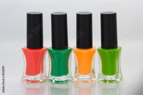 Group of bright nail polishes on white