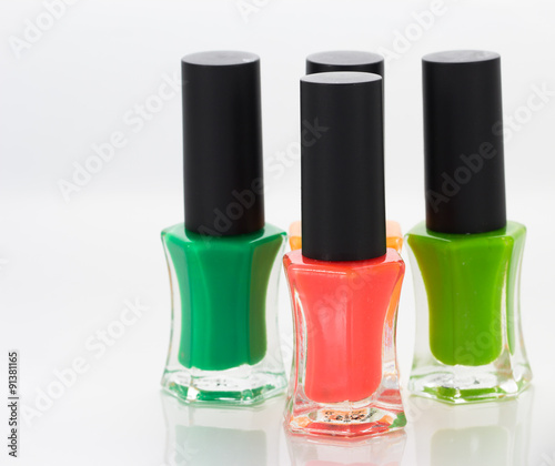Group of bright nail polishes on white