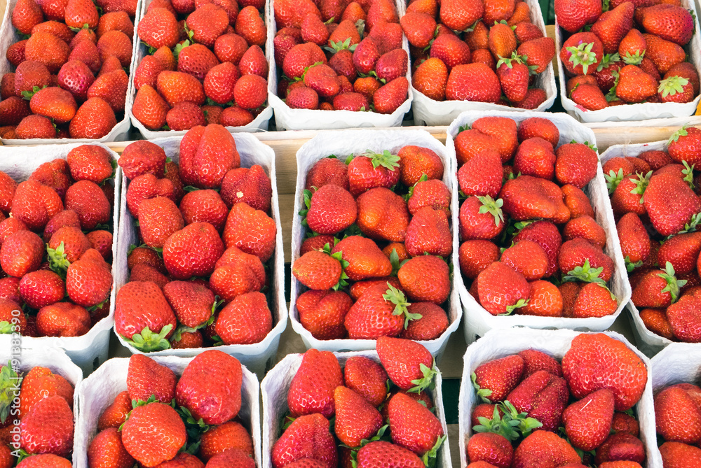 Fresh ripe strawberries for sale at a market Fresh ripe strawberries for sale at a market