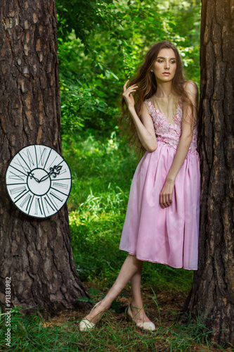 portrait of a young girl in a pink dress as Alice in Wonderland